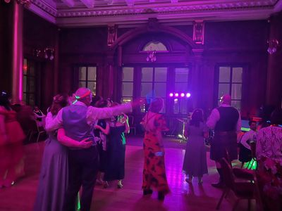 A packed hall mid-ceilidh, the whole room in motion