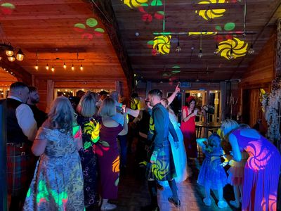 A barn ceilidh awash in atmospheric green light