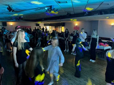 The dancefloor packed front to back, all ages joining in